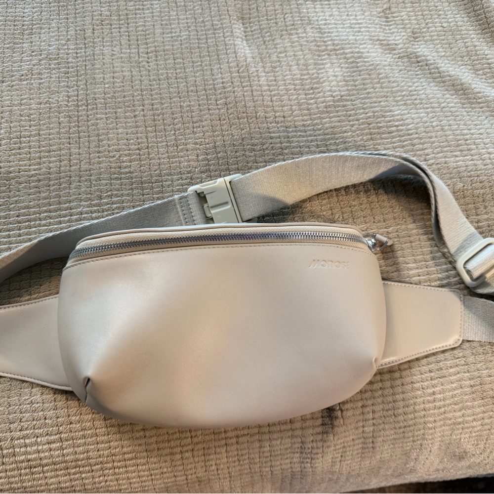 Versatile Cream Leather Belt Bag with Subtle Branding